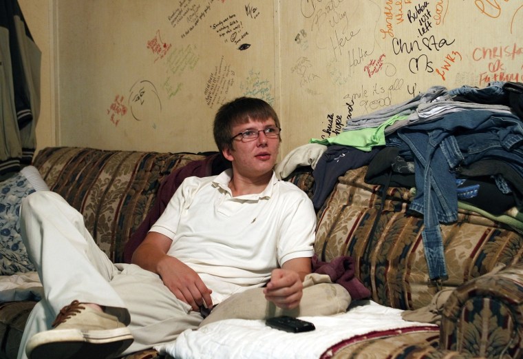 Stewart sits in the living room at his current home in Gordon